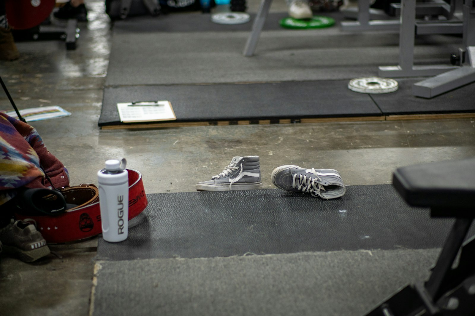 Pair of athletic shoes on a gym floor, representing the best HYROX shoes for 2026